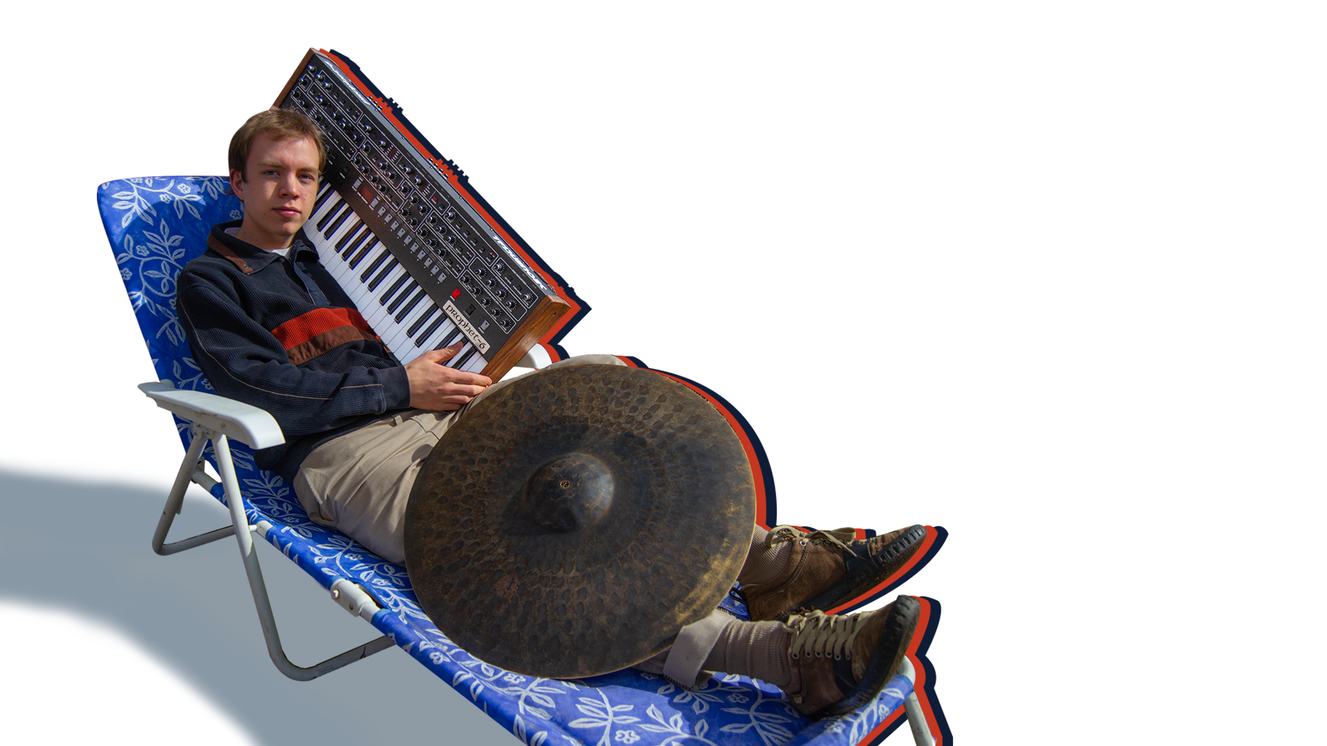 Erik sitting in a lawn chair with a cymbal and prophet 6